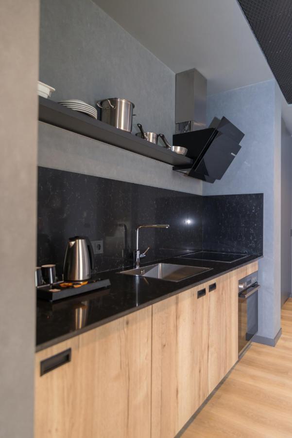 mk hotel tirana Rinas Eksteriør billede A kitchen in a serviced apartment in Paris